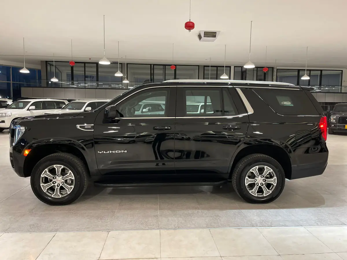 Black GMC Yukon, side view