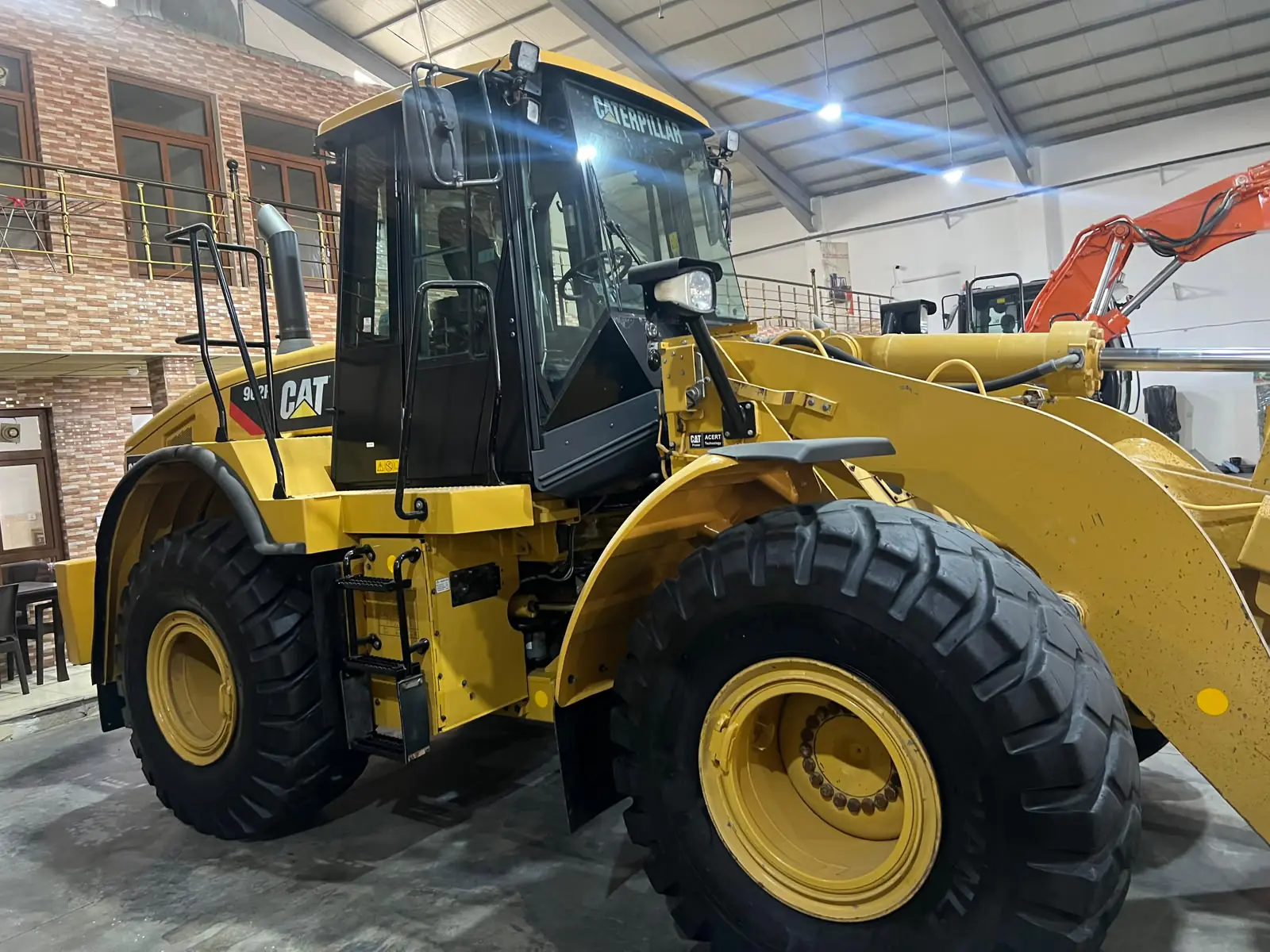 Wheel loader in a clean, well-lit maintenance hall