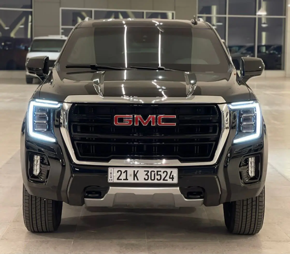 GMC Yukon, front view, in a showroom